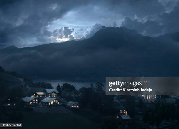 a picturesque postcard view of spiez - maanlicht stockfoto's en -beelden