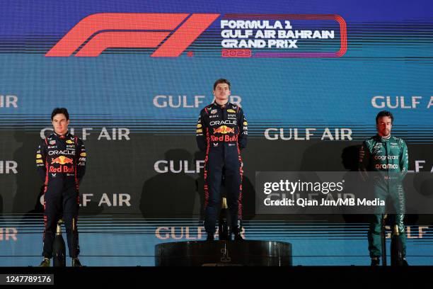 Sergio Perez of Mexico and Oracle Red Bull Racing , Max Verstappen of the Netherlands and Oracle Red Bull Racing and Fernando Alonso of Spain and...