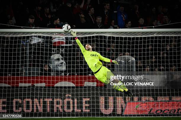 Marseille's Spanish goalkeeper Pau Lopez saves a goal during the French L1 football match between Stade Rennais and Olympique de Marseille at the...