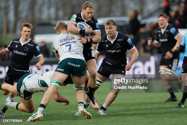 Tom Pearson of London Irish tackles Alex Tait of Newcastle Falcons during the Gallagher Premiership match between Newcastle Falcons and London Irish...