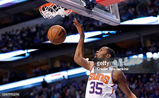 Kevin Durant of the Phoenix Suns slam dunks in the second half of the game against the Dallas Mavericks at American Airlines Center on March 5, 2023...