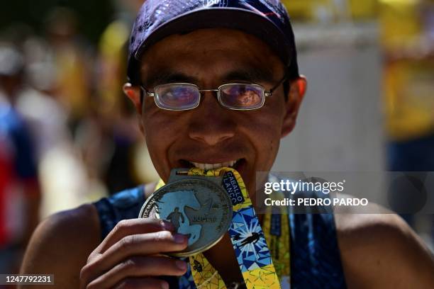 Jupiter Carera shows his medal after winning the ultramarathon "Caballo Blanco" in the Tarahumara mountains in Urique, Chihuahua State, Mexico, on...