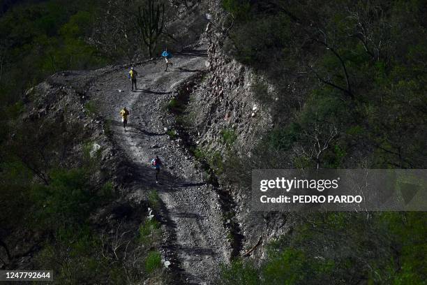 People compete in the ultramarathon "Caballo Blanco" in the Tarahumara mountains in Urique, Chihuahua State, Mexico, on March 5, 2023. - Hundreds of...