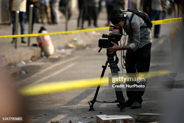 Journalist during work at the blast scene as a building partially collapsed in an explosion near The new market area in Dhaka, Bangladesh on Sunday,...
