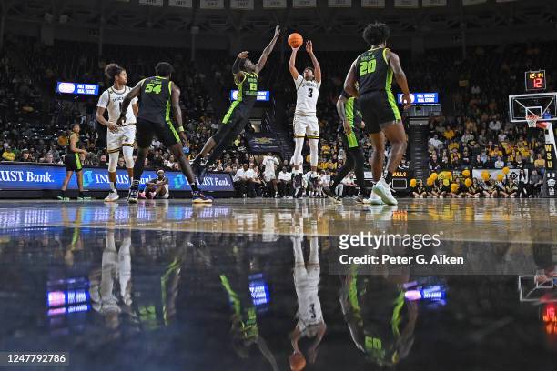 Craig Porter Jr. #3 of the Wichita State Shockers puts up a shot against Keyshawn Bryant of the South Florida Bulls during the first half of a...