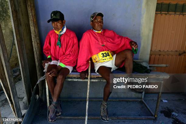 Raramuri men rest after the ultramarathon "Caballo Blanco" in the Tarahumara mountains in Urique, Chihuahua State, Mexico, on March 5, 2023. -...