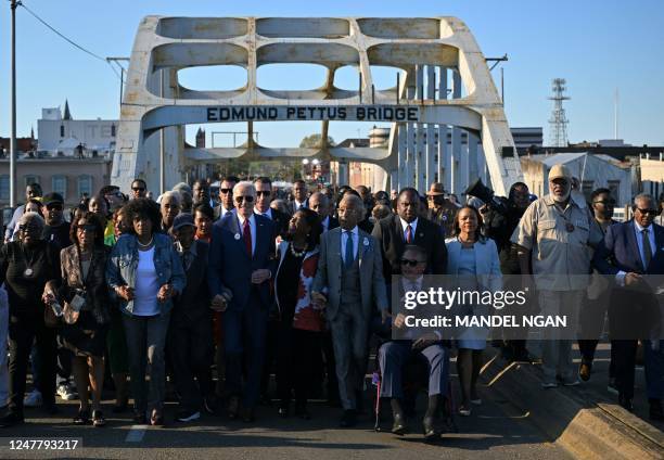 President Joe Biden, joined by US Representative Terri Sewell , Reverend Al Sharpton, Reverend Jesse Jackson, Martin Luther King III, and fellow...