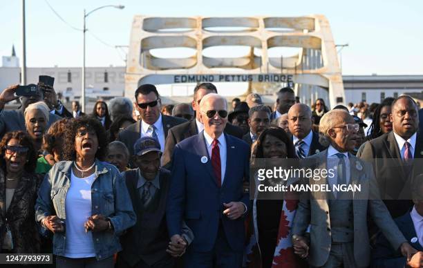 President Joe Biden, joined by US Representative Terri Sewell , Reverend Al Sharpton, Reverend Jesse Jackson, Martin Luther King III, and fellow...