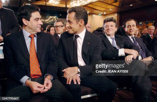 French president Nicolas Sarkozy chats with French Prime minister Francois Fillon next to French minister for ecology, sustainable development and...