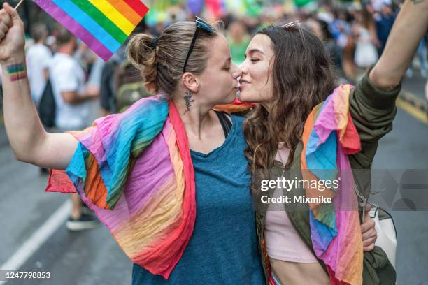 female couple kissing - light festival parade stock pictures, royalty-free photos & images