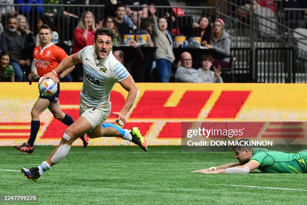 Argentina's Rodrigo Isgro scores a try against Ireland during the annual HSBC Canada Rugby Sevens tournament at BC Place in Vancouver, Canada, on...