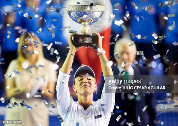 Croatia's tennis player Donna Vekic raises the trophy after winning the Monterrey WTA Open final match against France's Caroline Garcia in Monterrey,...