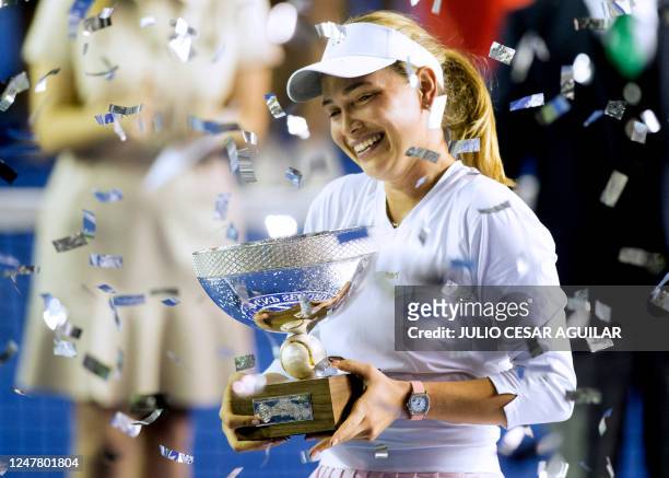Croatia's tennis player Donna Vekic poses with the trophy after winning the Monterrey WTA Open final match against France's Caroline Garcia in...