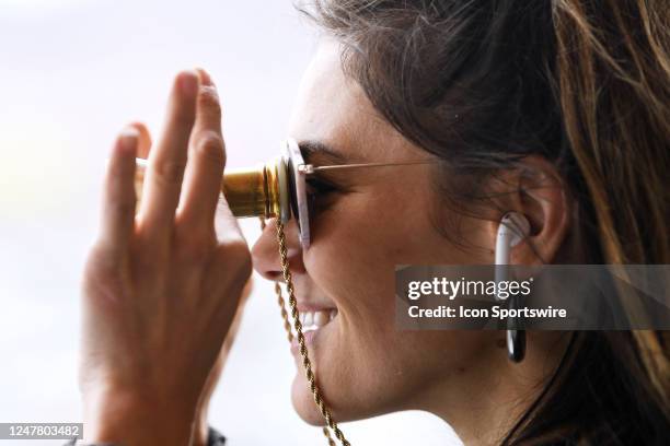 Woman uses opera glasses to watch the NASCAR Cup Series Pennzoil 400 presented by Jiffy Lube on March 5 Las Vegas Motor Speedway in Las Vegas, NV.