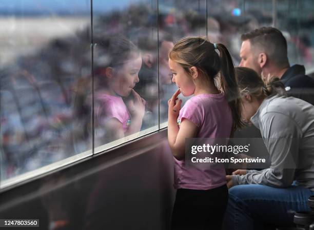 Young girls watches the race from a suite during the NASCAR Cup Series Pennzoil 400 presented by Jiffy Lube on March 5 Las Vegas Motor Speedway in...