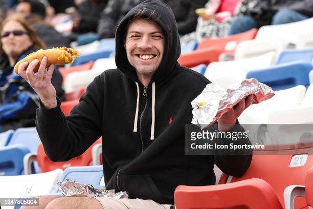 Fan enjoys a hotdog during the NASCAR Cup Series Pennzoil 400 presented by Jiffy Lube, on March 5 at Las Vegas Motor Speedway in Las Vegas, NV.