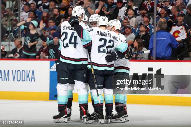 Jamie Oleksiak, Will Borgen, Alex Wennberg, Oliver Bjorkstrand and Jaden Schwartz of the Seattle Kraken celebrate a goal against the Colorado...