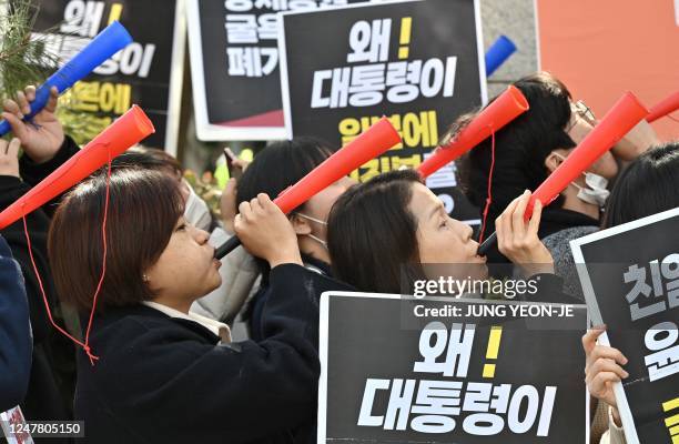 South Korean protesters hold a rally against South Korea's announcement of plans to compensate victims of Japan's forced wartime labour, outside the...