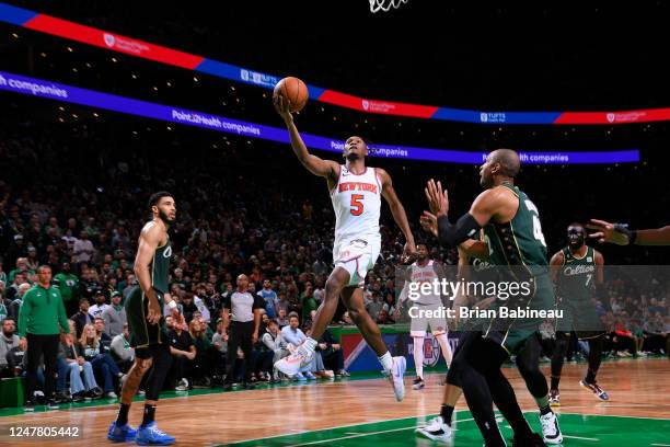 Immanuel Quickley of the New York Knicks drives to the basket during the game against the Boston Celtics on March 5, 2023 at the TD Garden in Boston,...