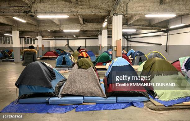 This photograph taken on March 1 shows tents for people in administrative difficulties, including undocumented and migrants and asylum seekers,...