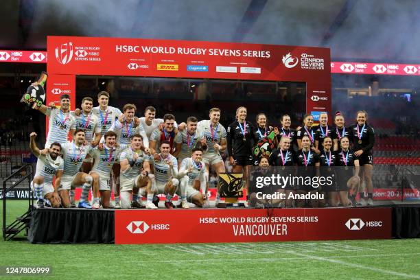 Players of Argentina and New Zealand pose on the podium after the final game of the World Rugby Seven Series 2023 BC Place Stadium in Vancouver,...