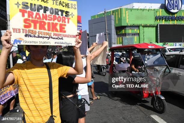 Members of a youth group supporting striking jeepney drivers join a rally in Caloocan City, suburban Manila on March 6, 2023. - Operators of...