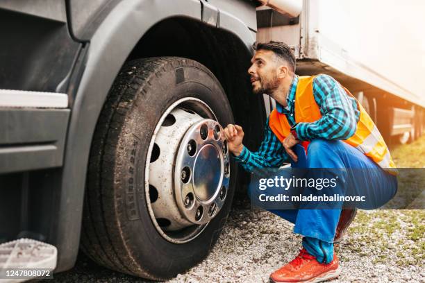 truck driver man - giant wheel stock pictures, royalty-free photos & images