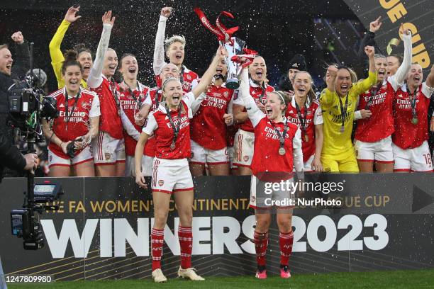 Leah Williamson of Arsenal Women and Kim Little of Arsenal Women lift the trophy during the FA Women's League Cup Final between Arsenal and Chelsea...
