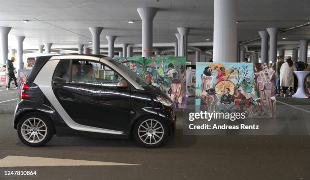 Visitors, sitting in their cars ,drive through at the "Nachtbroetchen 2.0" drive-in Pop-up-Exhibition during the Coronavirus crisis at Airport...