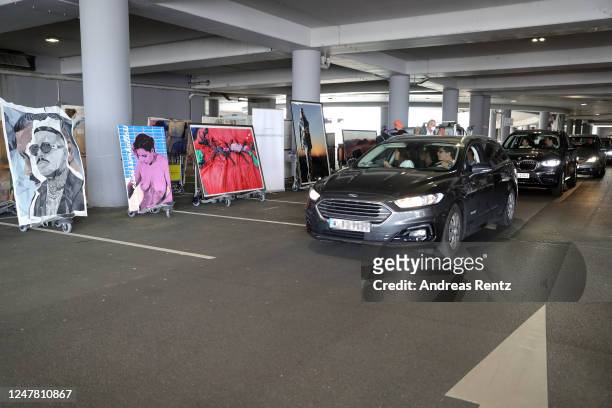 Visitors, sitting in their cars ,drive through at the "Nachtbroetchen 2.0" drive-in Pop-up-Exhibition during the Coronavirus crisis at Airport...
