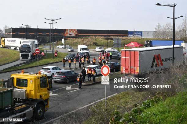 French Trade Unionists of the CGT take part in a "filtering operation" to announce actions for a nationwide strike planned for March 7 at the...