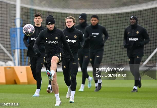 Chelsea's English defender Ben Chilwell kicks a ball as he attends a team training session at Chelsea's Cobham training facility in Stoke D'Abernon,...