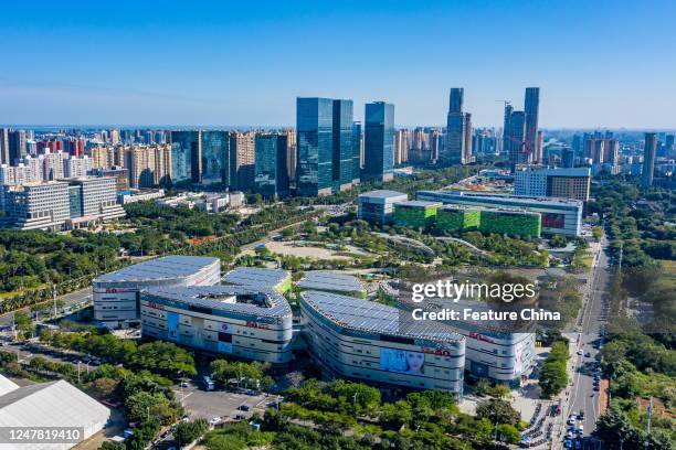 An aerial view of the a shopping mall under solar panel roofs in Haikou in south China's Hainan province Sunday, March 05, 2023. The solar panels...