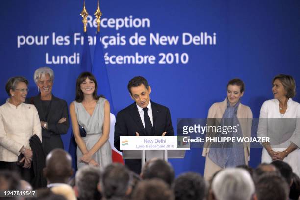 France's President Nicolas Sarkozy is surrounded by Foreign Affairs Minister Michele Alliot-Marie , Finance and Economy Minister Christine Lagarde ,...
