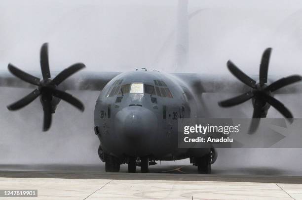 Super Hercules aircraft welcomed with water salute at Halim Perdanakusuma Air Force Base in Jakarta, Indonesia on March 6, 2023. The Indonesian Air...