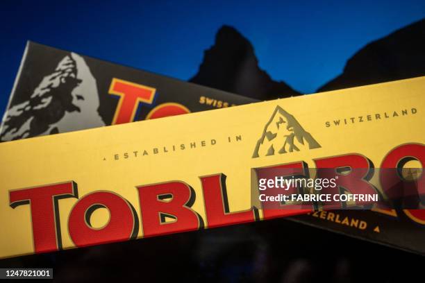 Picture taken on March 6 shows packagings of Toblerone chocolate bars owned by US firm Mondelez with a representation of the Matterhorn mountain and...
