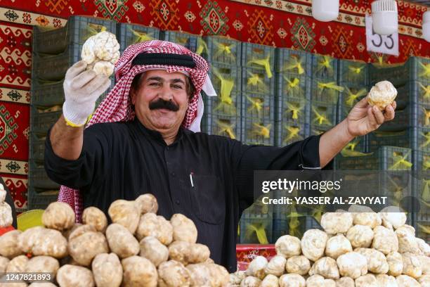 Vendor sells desert truffles, a delicacy unique to arid environments, at a market in Kuwait City of March 6, 2023.