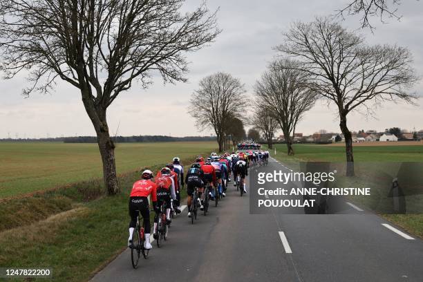 The pack of riders cycles during the 2nd stage of the 81st Paris - Nice cycling race, 164 km between Bazainville and Fontainebleau, on March 6, 2023.