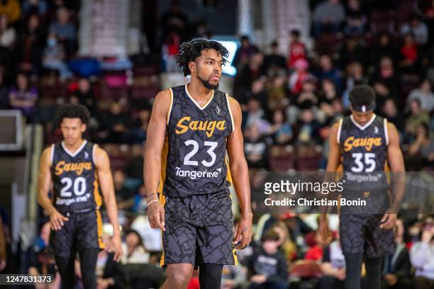 Sterling Brown, Jeff Dowtin Jr. #20 and Christian Koloko of the Raptors 905 come out of a time out during an NBA G League game against the Fort Wayne...