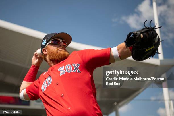 Justin Turner of the Boston Red Sox throws before a Grapefruit League game against the Detroit Tigers on March 6, 2023 at JetBlue Park at Fenway...