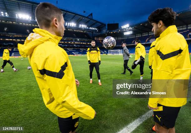 Raphael Guerreiro, Mahmoud Dahoud and Marco Reus of Borussia Dortmund in the final training session ahead of their UEFA Champions League round of 16...