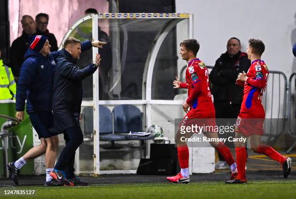 Louth , Ireland - 6 March 2023; John Ross Wilson of Shelbourne celebrates with manager Damien Duff after scoring their side's first goal during the...
