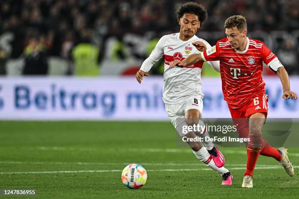 Enzo Millot of VfB Stuttgart and Joshua Kimmich of Bayern Muenchen battle for the ball during the Bundesliga match between VfB Stuttgart and FC...