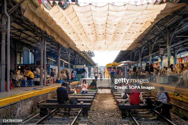 People hang out at an outdoor market outside of Taichung Station. Daily life in Taichung, the second-largest city in Taiwan.