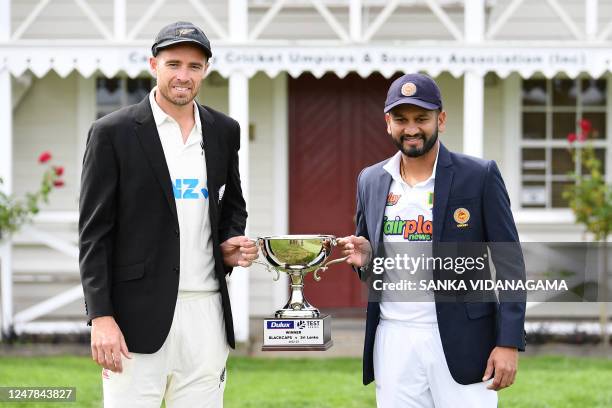 New Zealand's captain Tim Southee and Sri Lankas captain Dimuth Karunaratne pose with the Test Series trophy during a media opportunity ahead of the...