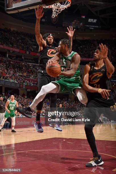 Marcus Smart of the Boston Celtics passes the ball during the game against the Cleveland Cavaliers on March 6, 2023 at Rocket Mortgage FieldHouse in...