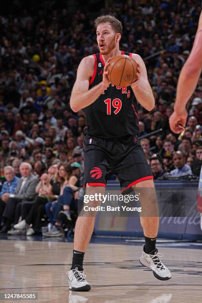 Jakob Poeltl of the Toronto Raptors handles the ball during the game against the Denver Nuggets on March 6, 2023 at the Ball Arena in Denver,...