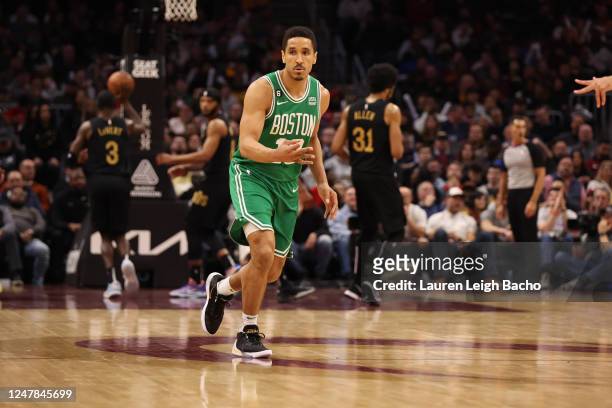 Malcolm Brogdon of the Boston Celtics celebrates a three point basket during the game against the Cleveland Cavaliers on March 6, 2023 at Rocket...