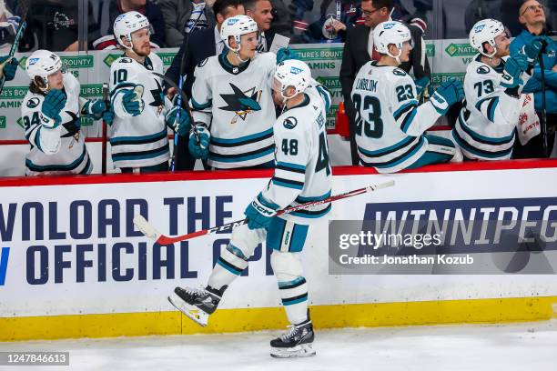 Tomas Hertl of the San Jose Sharks celebrates his third period goal against the Winnipeg Jets with teammates at the bench at the Canada Life Centre...