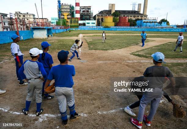 Children take part of a baseball training class in Havana, on March 6, 2023. - The 2023 World Baseball Classic begins March 7, 2023 when the...